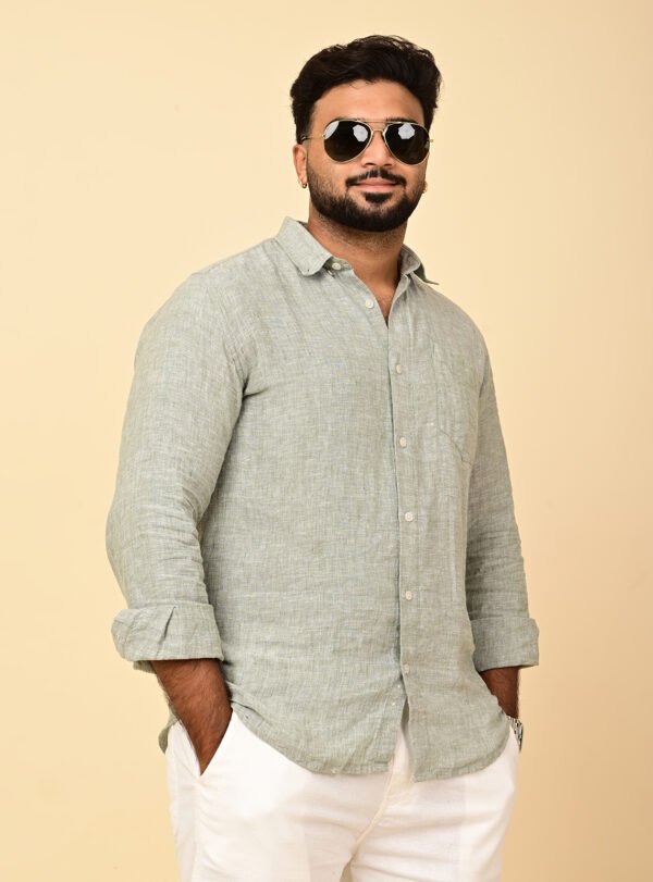 Home Man wearing a premium sage green pure linen full sleeve shirt with a classic collar and relaxed fit.