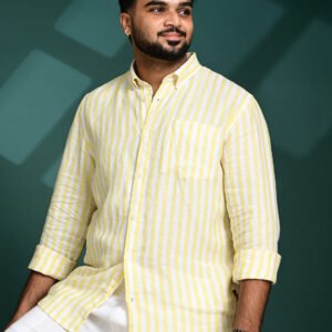 Close-up of a yellow striped pure linen shirt showing premium fabric texture and stitching