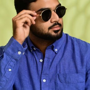 Men's royal blue linen shirt close-up showcasing premium craftsmanship.