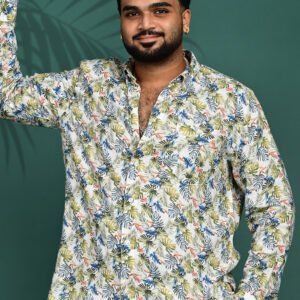 Men wearing a white tropical leaf print pure linen full sleeve shirt with premium button-down collar.